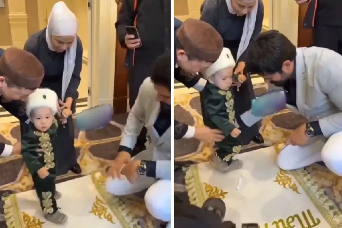 Burak Özçivit çocuğun yürüme töreninde kurdele kesiyor